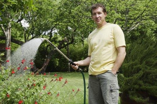 Professional garden clearance removing overgrown waste in an Ickenham residential garden